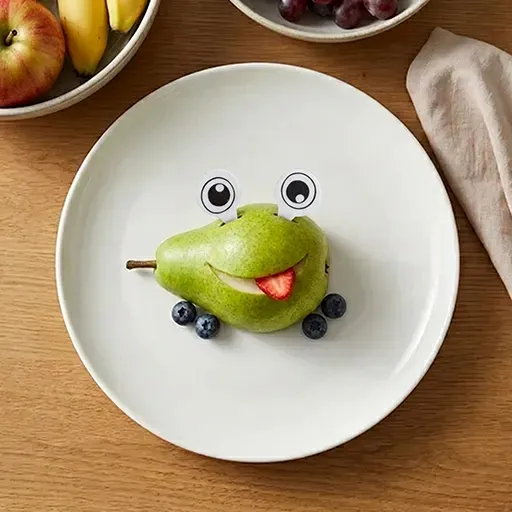 Pear Monster Trio frog face: a pear with googly eyes, a strawberry-slice tongue sticking out, and blueberry feet